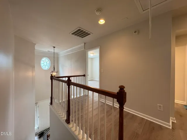 a view of a hallway with windows