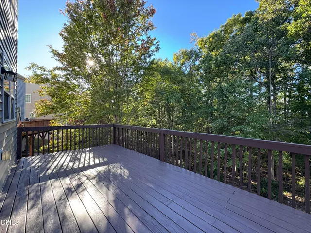 a view of balcony with wooden floor