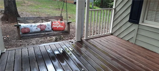 a view of outdoor space with wooden floor