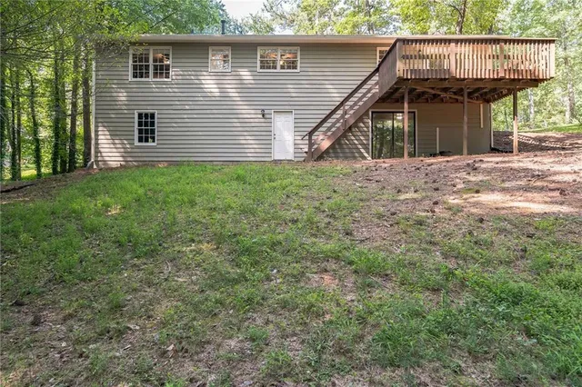 a view of a wooden deck with trees