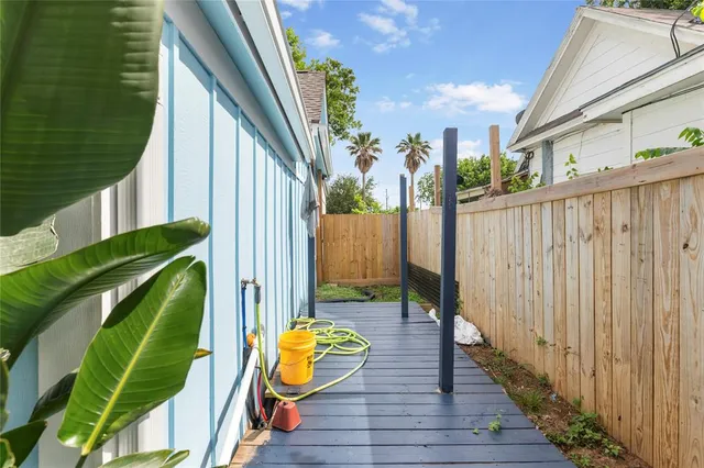 a view of a porch with furniture and a potted plant