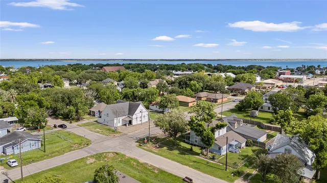 an aerial view of a golf course with parking space