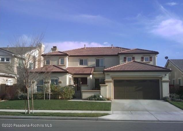 4345 Cloudywing Road Hemet, CA 92545 - Photo 1 of 18 a front view of a house with a yard