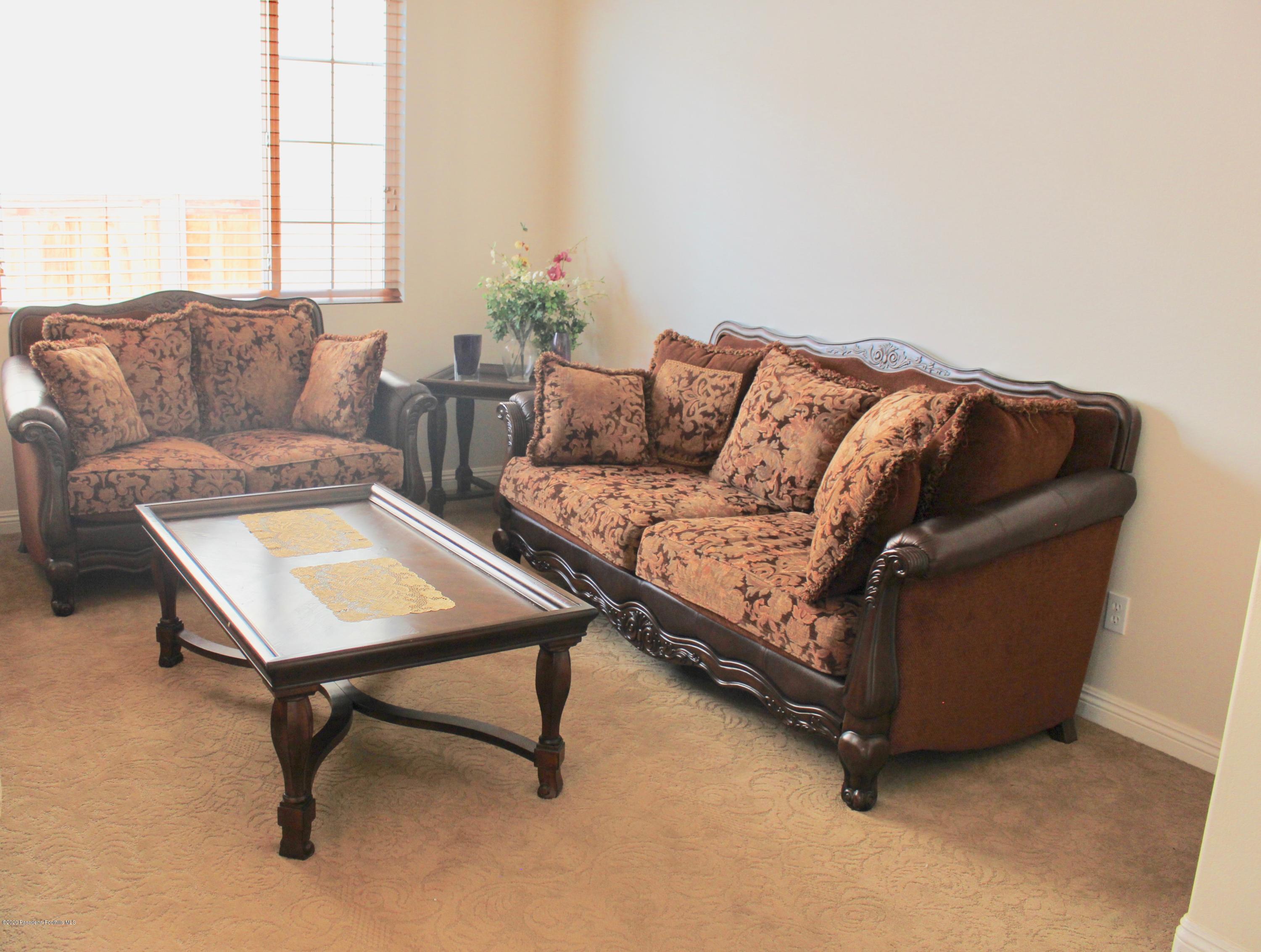 4345 Cloudywing Road Hemet, CA 92545 - Photo 3 of 18 a living room with furniture and a window