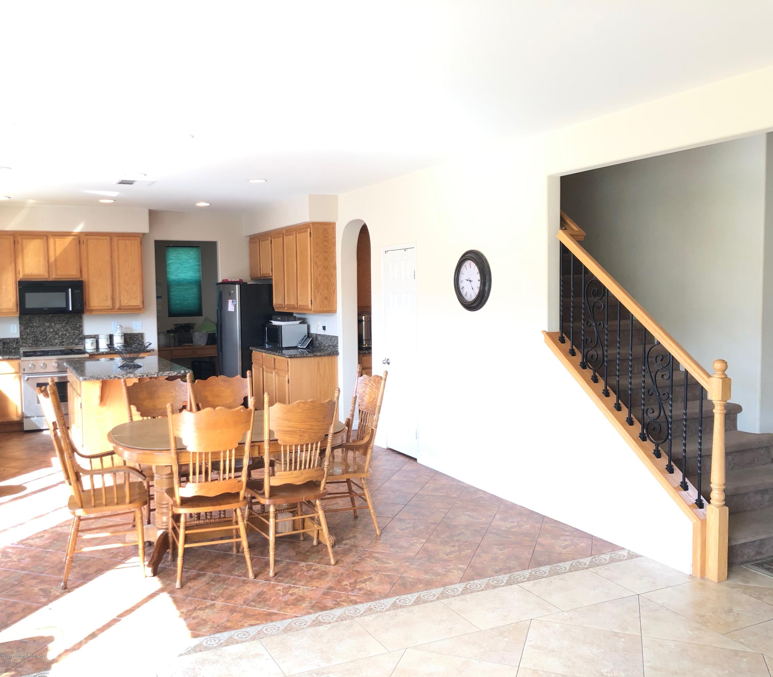 4345 Cloudywing Road Hemet, CA 92545 - Photo 5 of 18 a view of a dining room with furniture