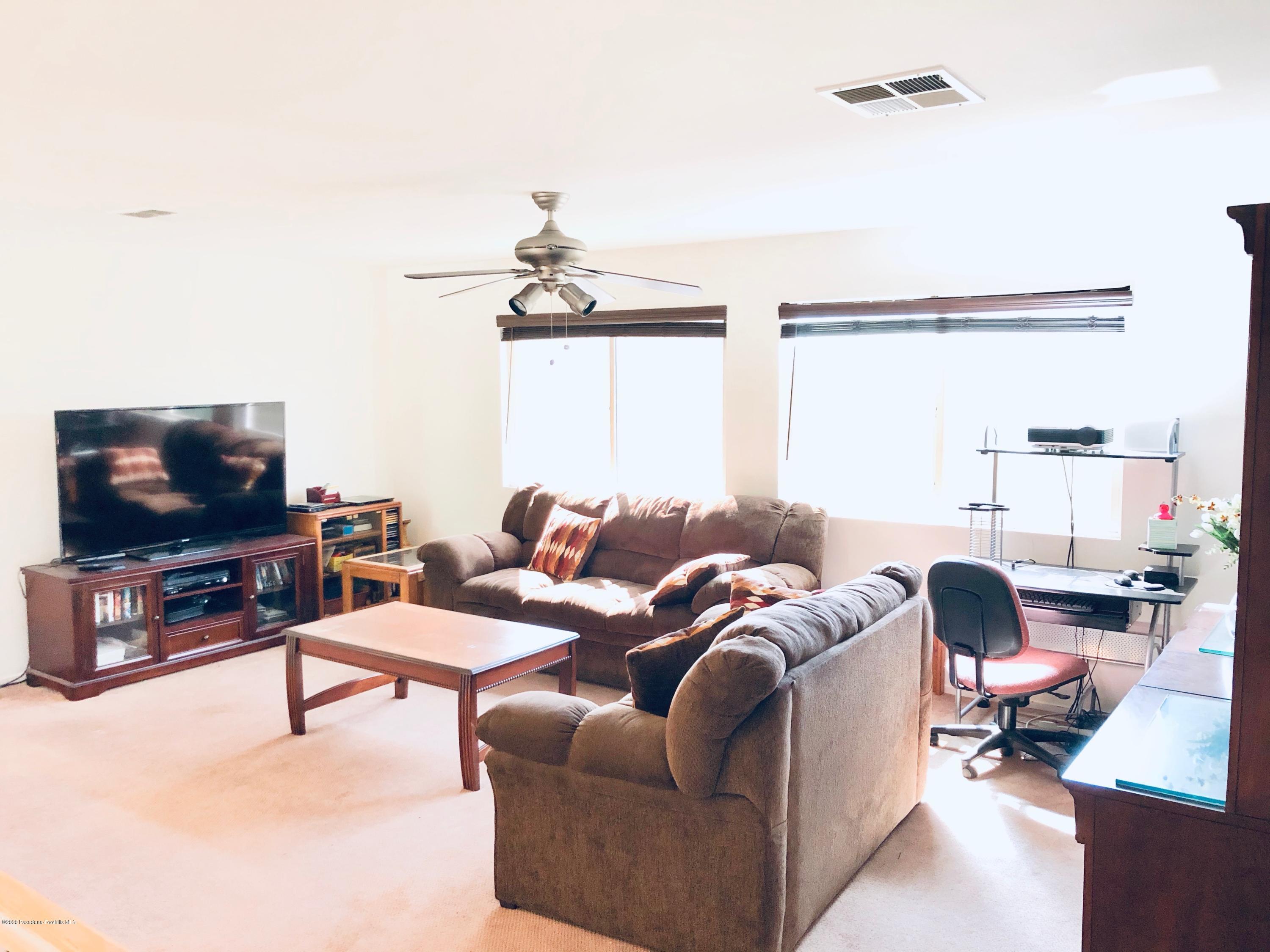 4345 Cloudywing Road Hemet, CA 92545 - Photo 10 of 18 a living room with furniture and a flat screen tv