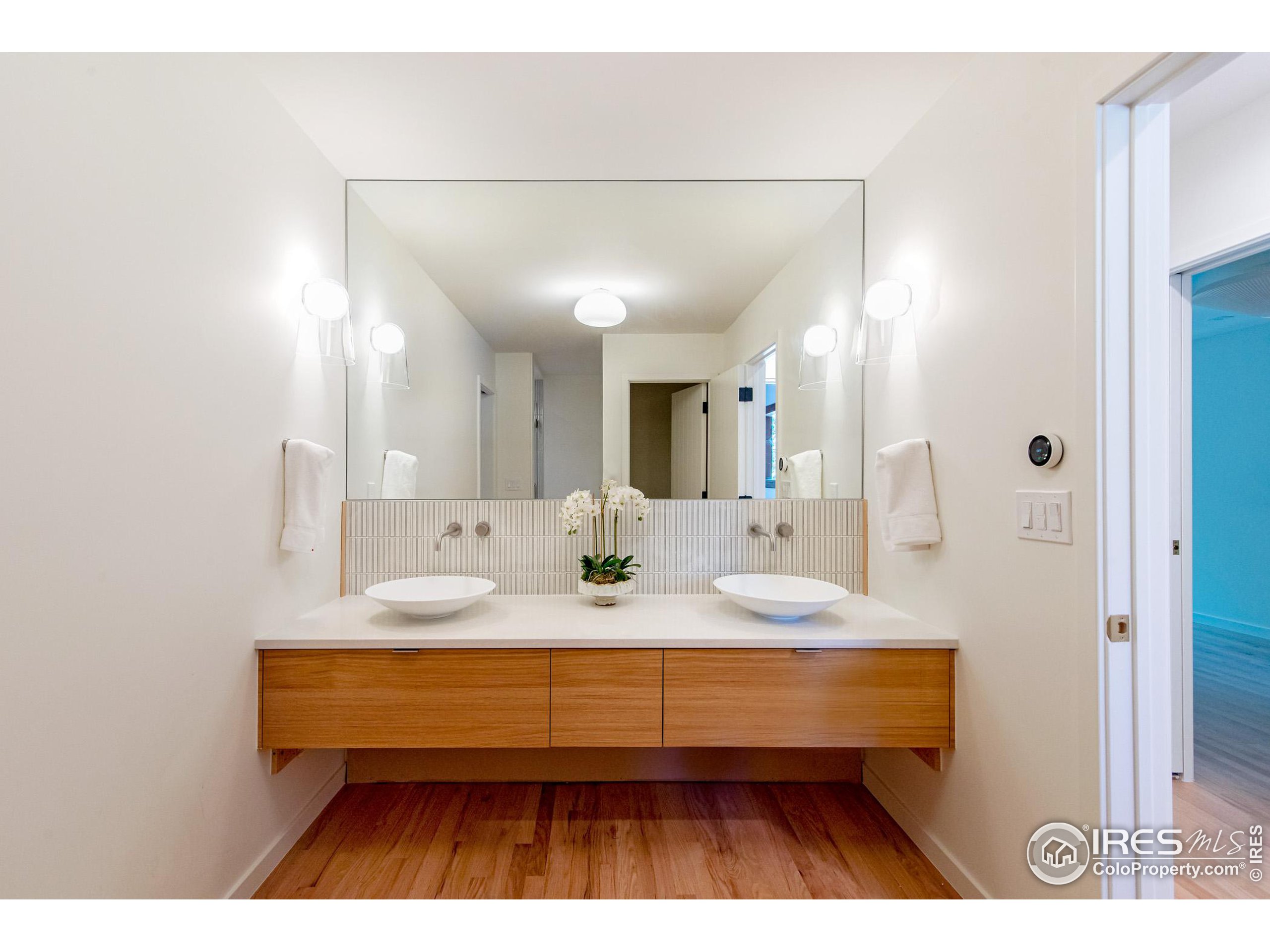 2323 4th Street Boulder, CO 80302 - Photo 12 of 40 a bathroom with a sink and a mirror