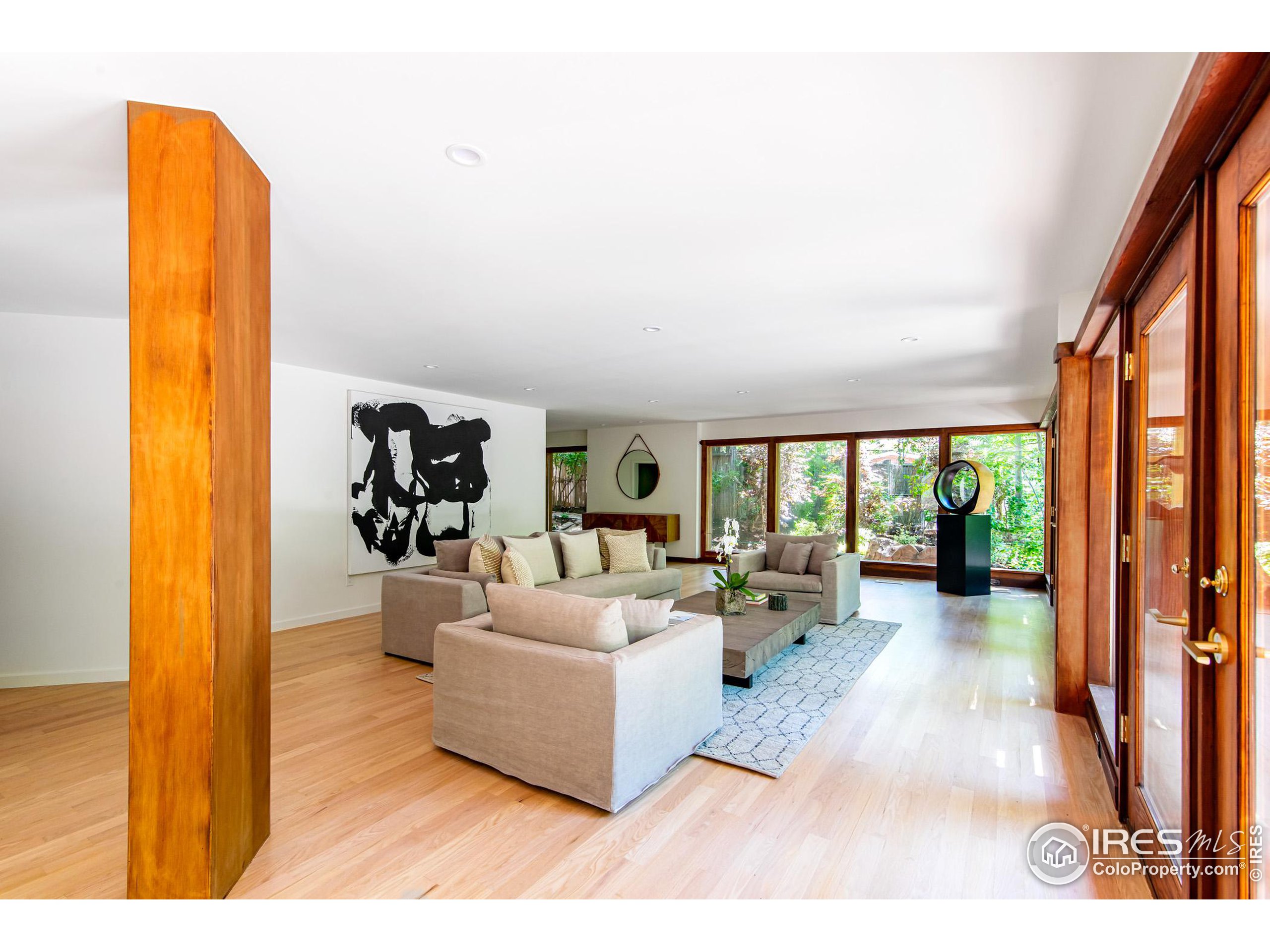 2323 4th Street Boulder, CO 80302 - Photo 17 of 40 a living room with furniture and a large window