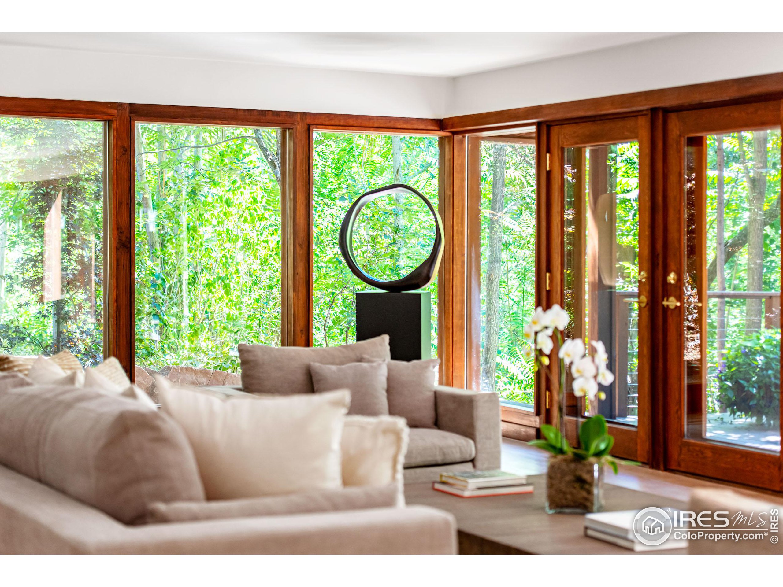2323 4th Street Boulder, CO 80302 - Photo 19 of 40 a living room with furniture and a large window