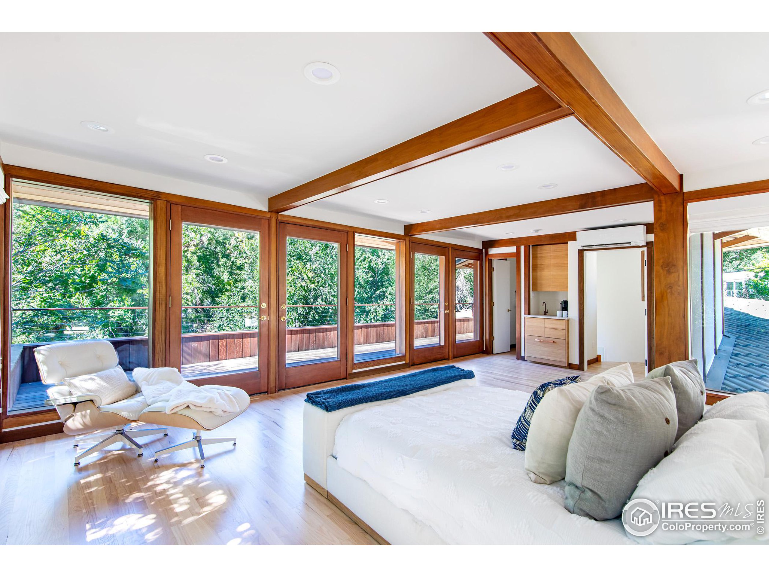 2323 4th Street Boulder, CO 80302 - Photo 21 of 40 a large bedroom with a large bed and a large window