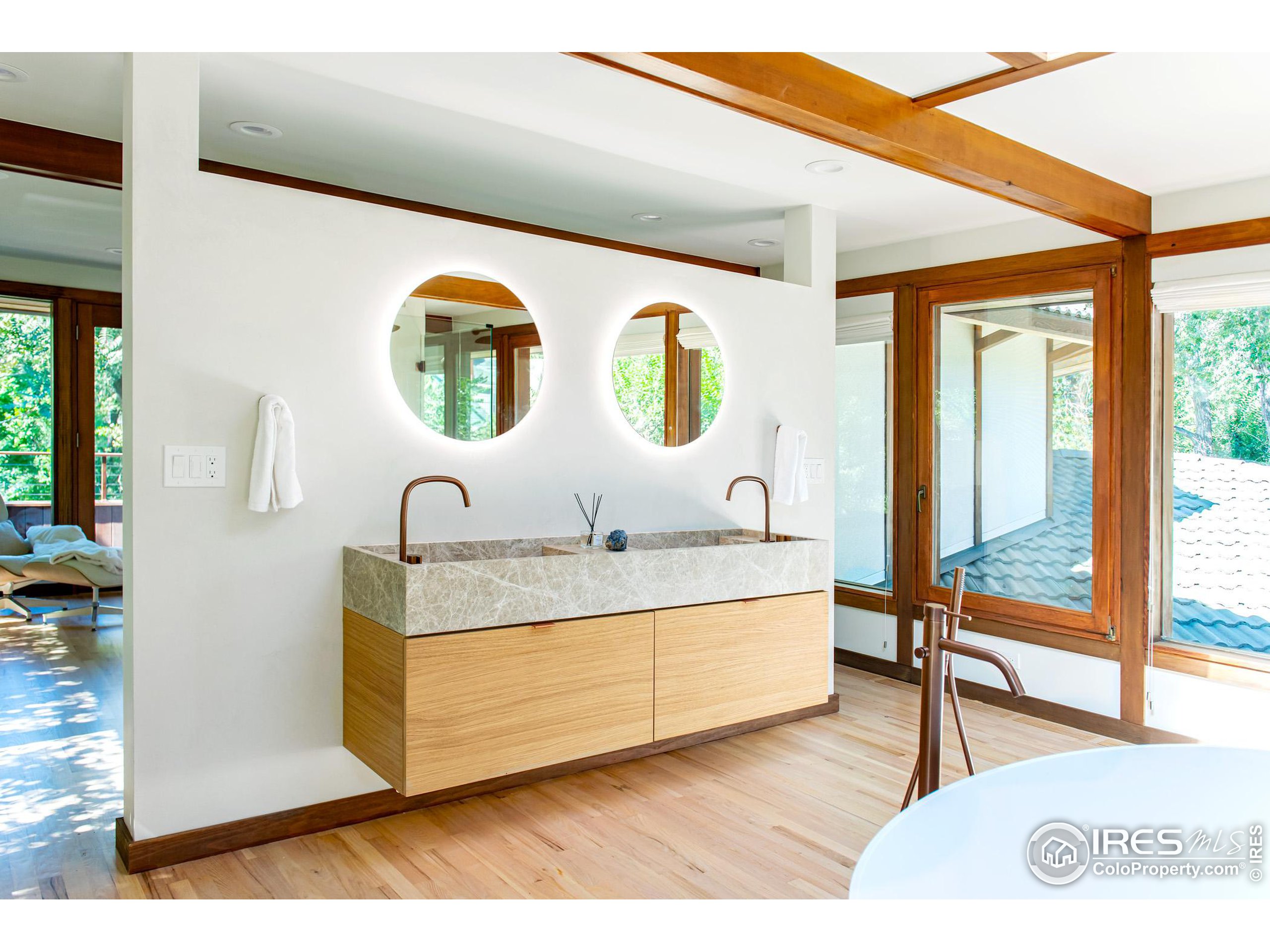 2323 4th Street Boulder, CO 80302 - Photo 22 of 40 a bathroom with a sink and a mirror