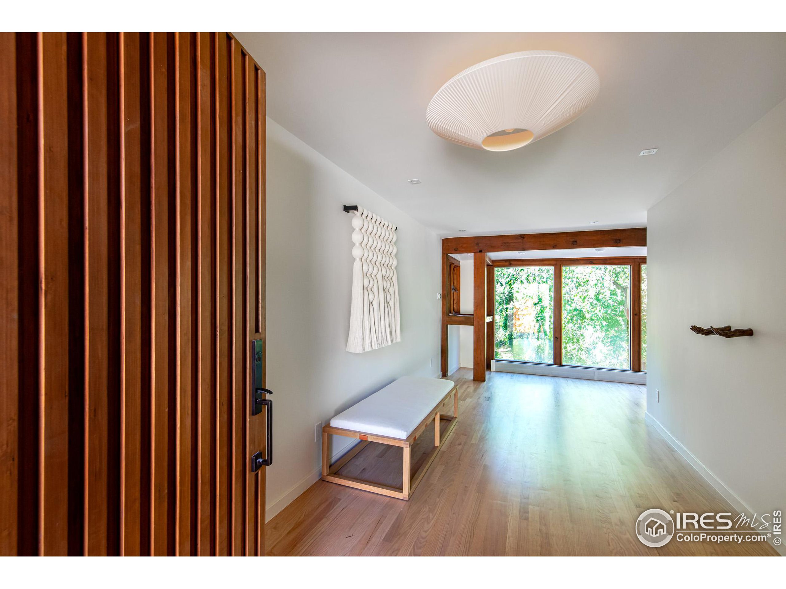 2323 4th Street Boulder, CO 80302 - Photo 26 of 40 a workspace with wooden floor and furniture