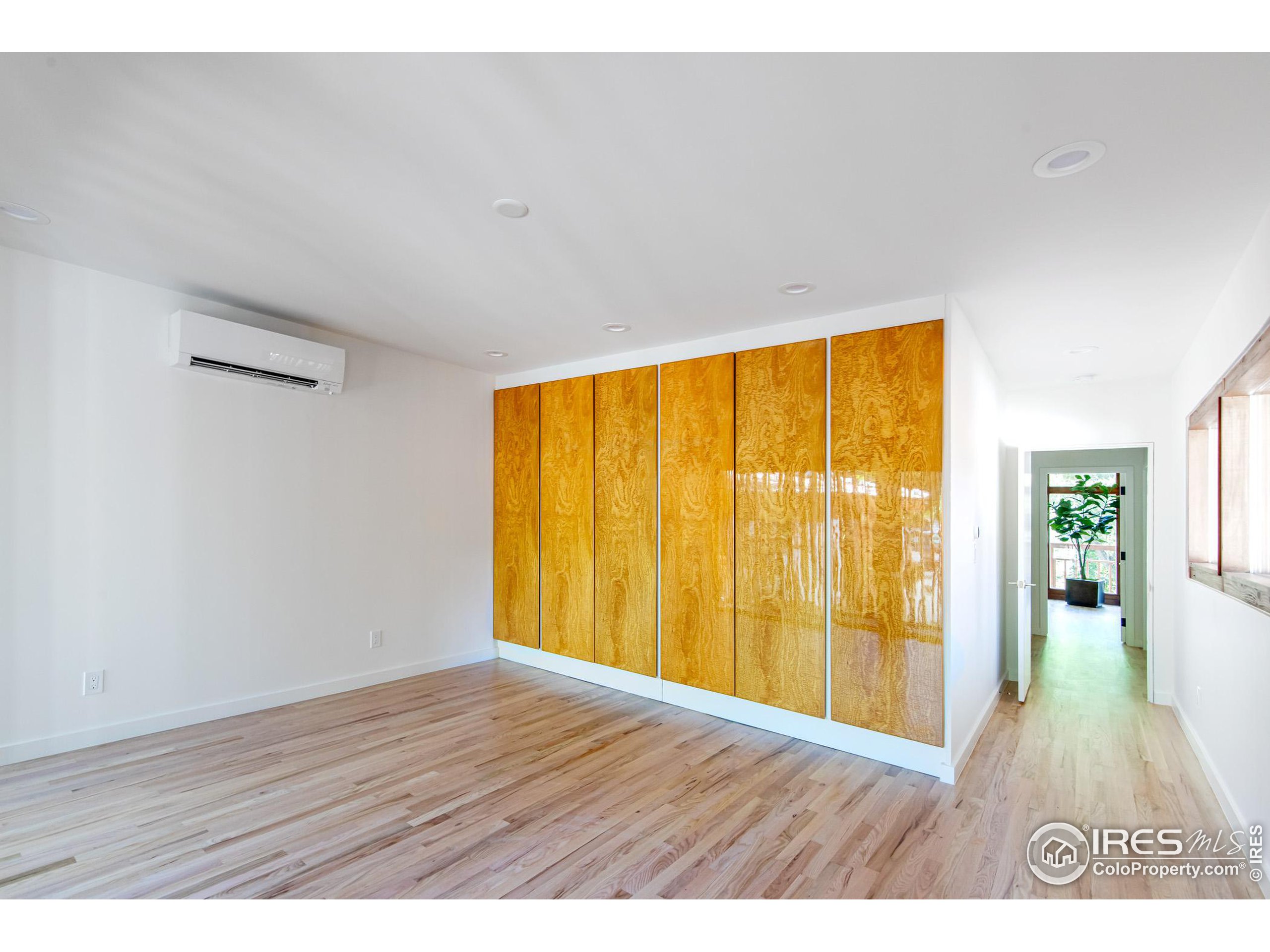 2323 4th Street Boulder, CO 80302 - Photo 28 of 40 a view of an empty room with wooden floor and a window