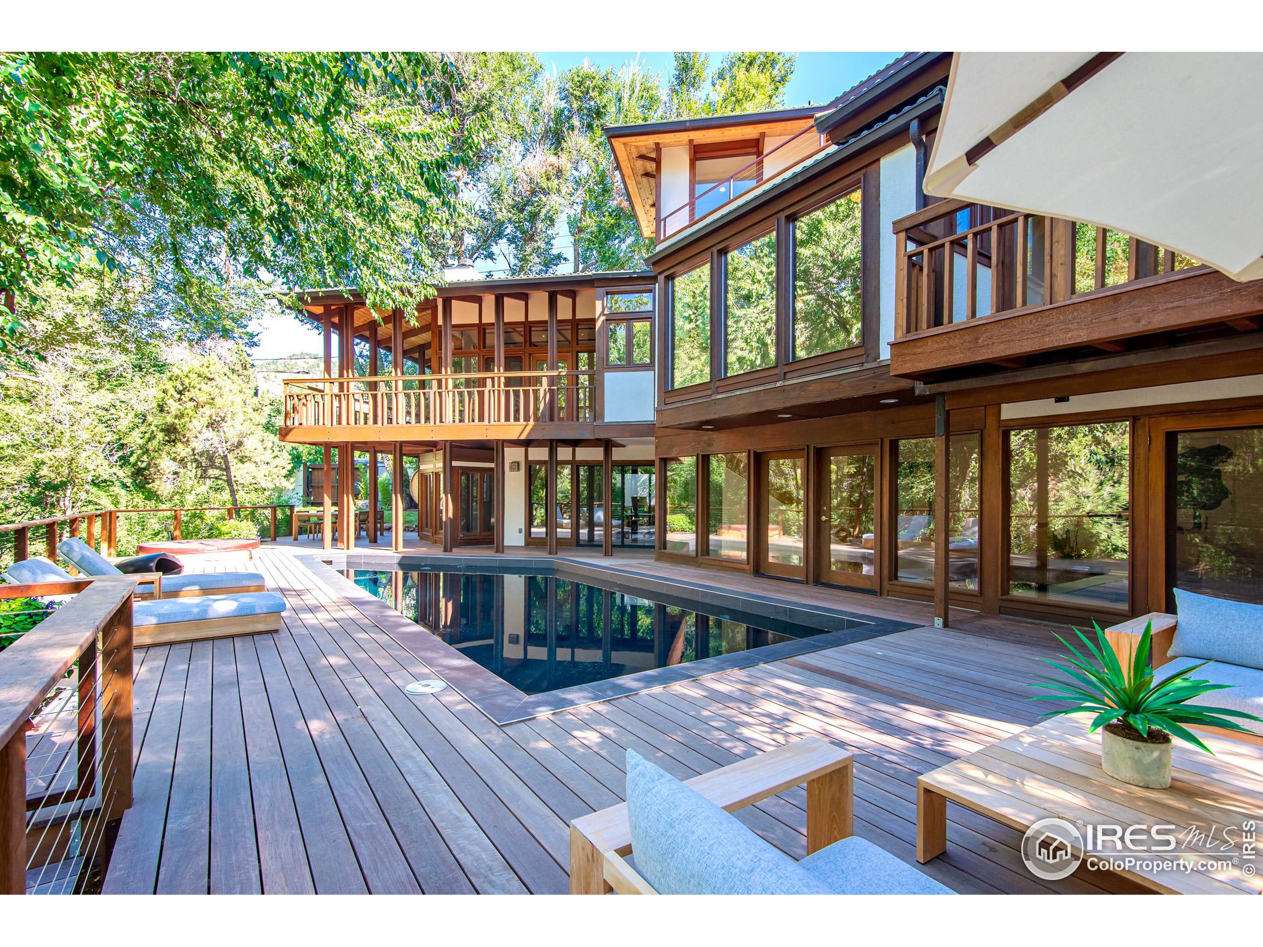 2323 4th Street Boulder, CO 80302 - Photo 32 of 40 a view of a house with pool and wooden floor