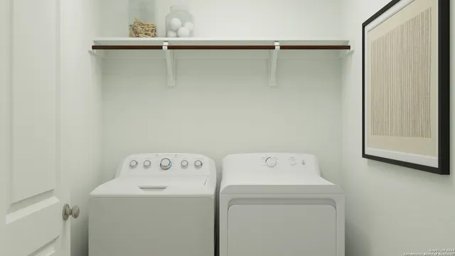 a utility room with dryer and washer
