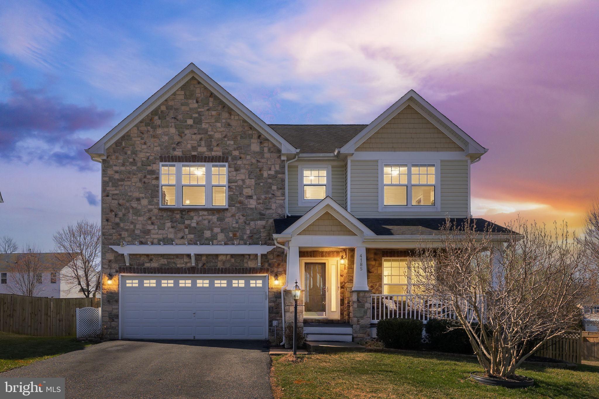 4185 Agency Loop Triangle, VA 22172 - Photo 1 of 46 a front view of a house with garden