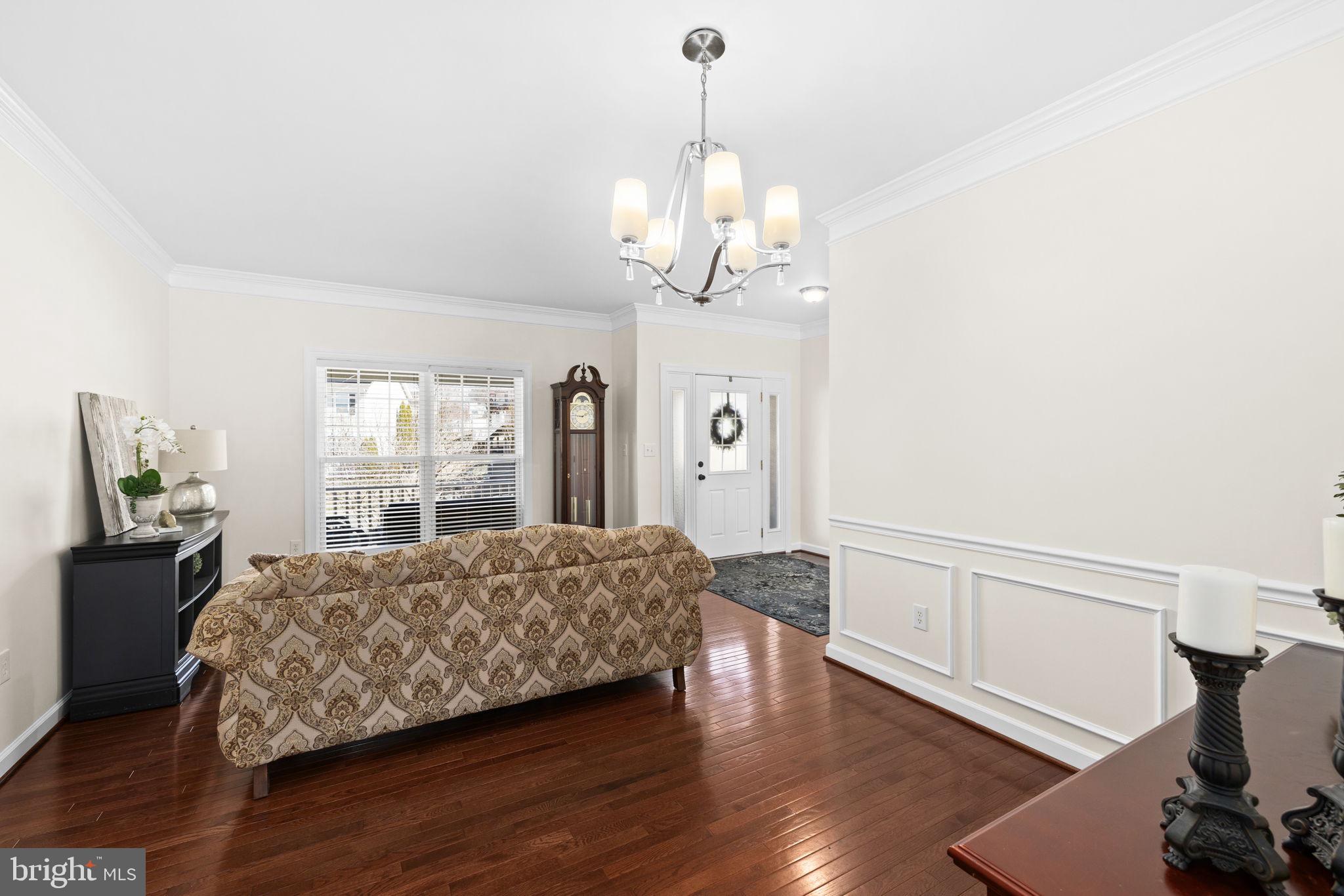 4185 Agency Loop Triangle, VA 22172 - Photo 11 of 46 a living room with a bed furniture and a window