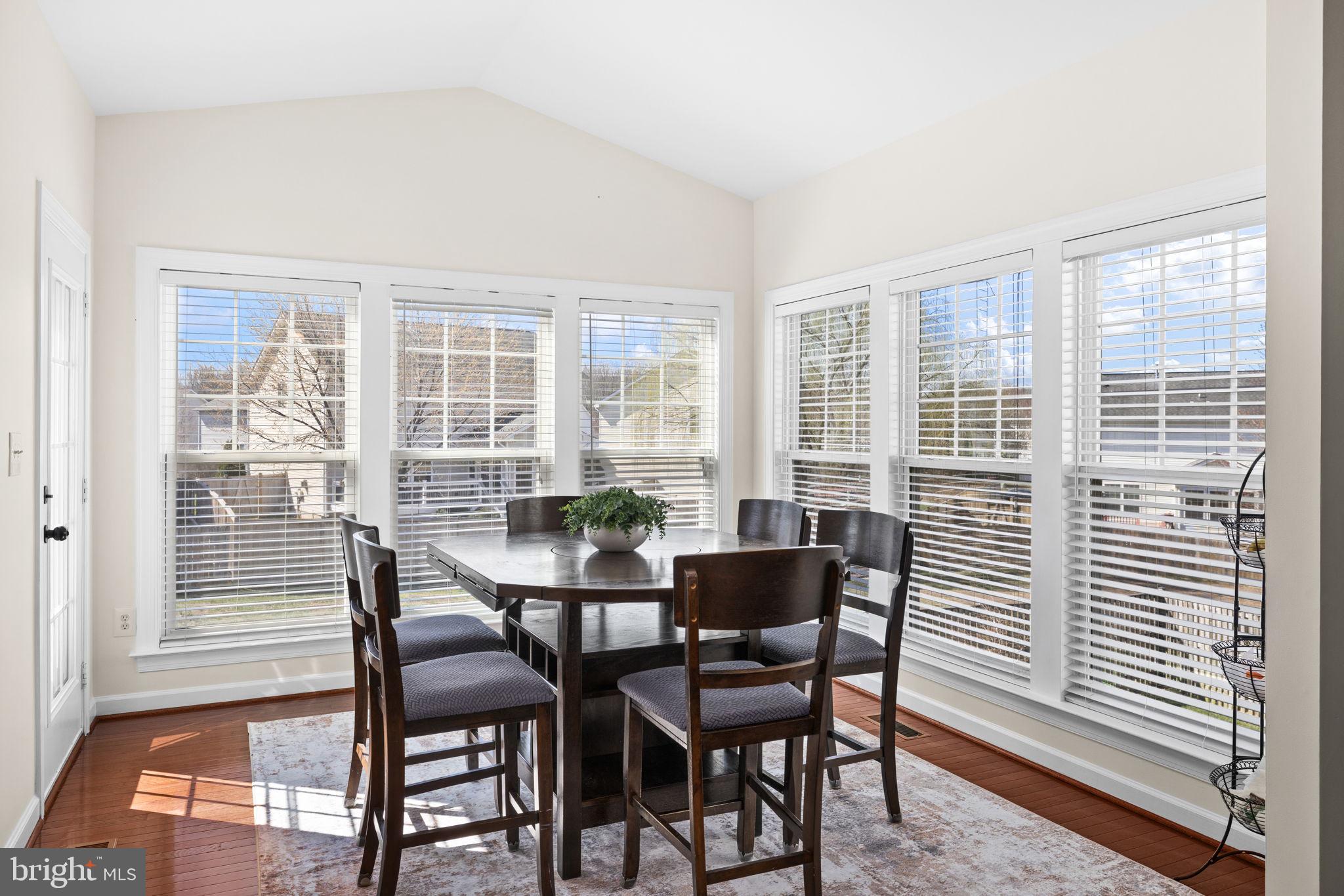 4185 Agency Loop Triangle, VA 22172 - Photo 15 of 46 a view of a dining room with furniture and windows