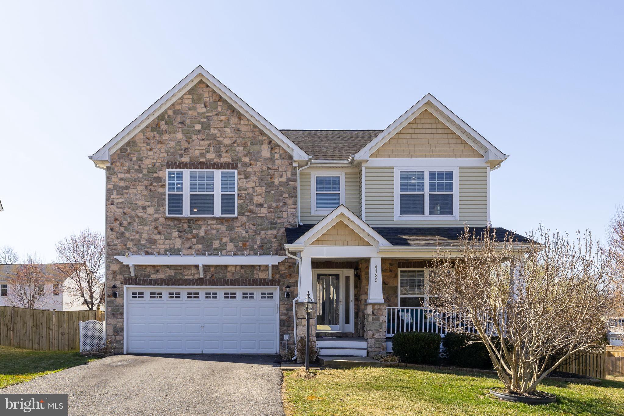 4185 Agency Loop Triangle, VA 22172 - Photo 2 of 46 a front view of a house with yard
