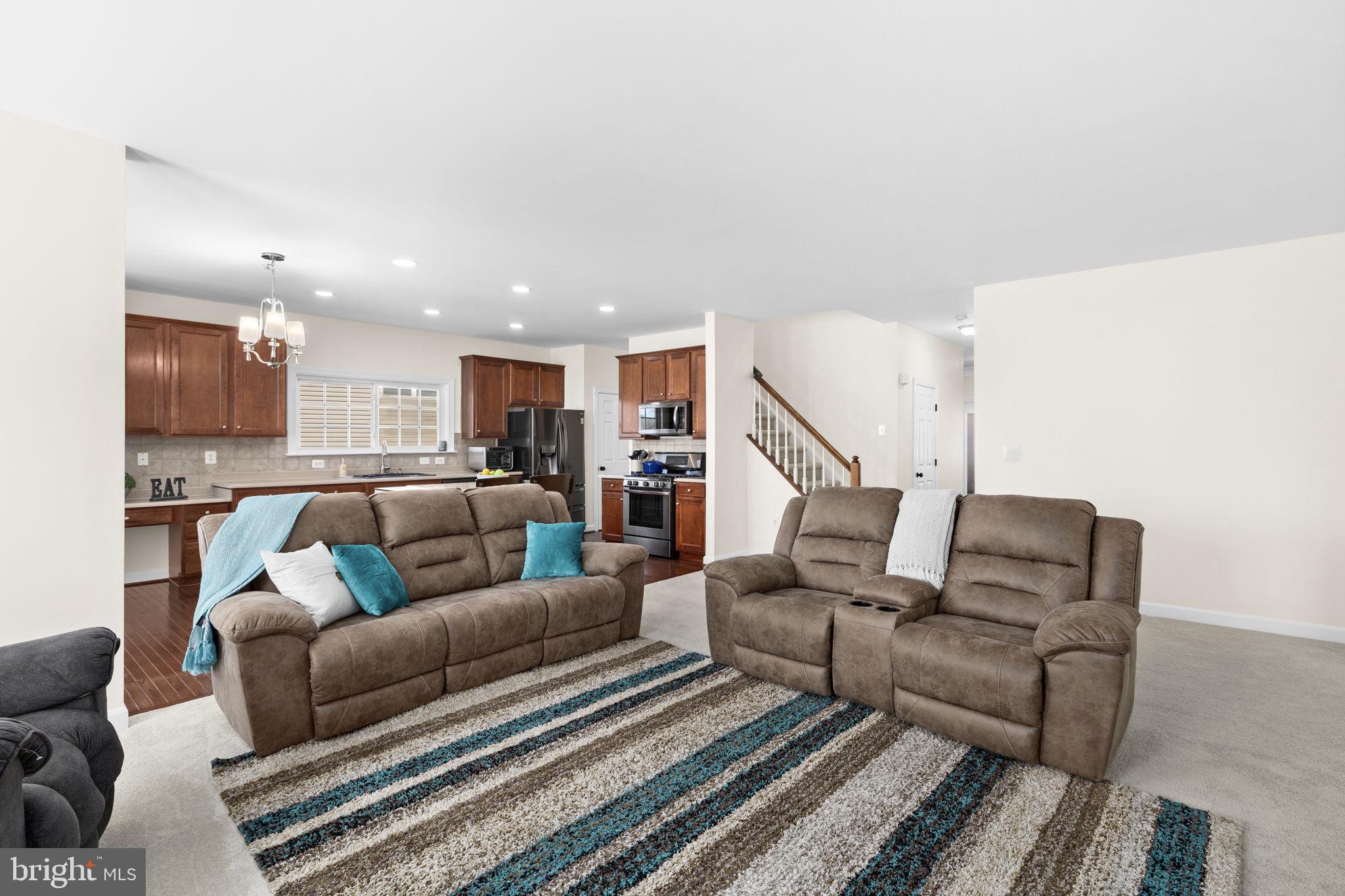 4185 Agency Loop Triangle, VA 22172 - Photo 22 of 46 a living room with furniture and a ceiling fan