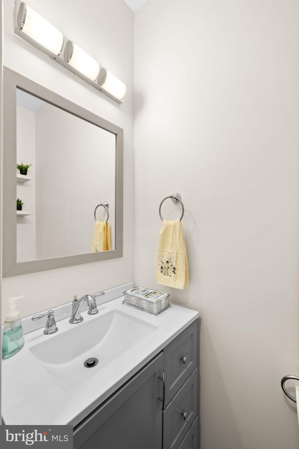 4185 Agency Loop Triangle, VA 22172 - Photo 24 of 46 a bathroom with a sink and a mirror