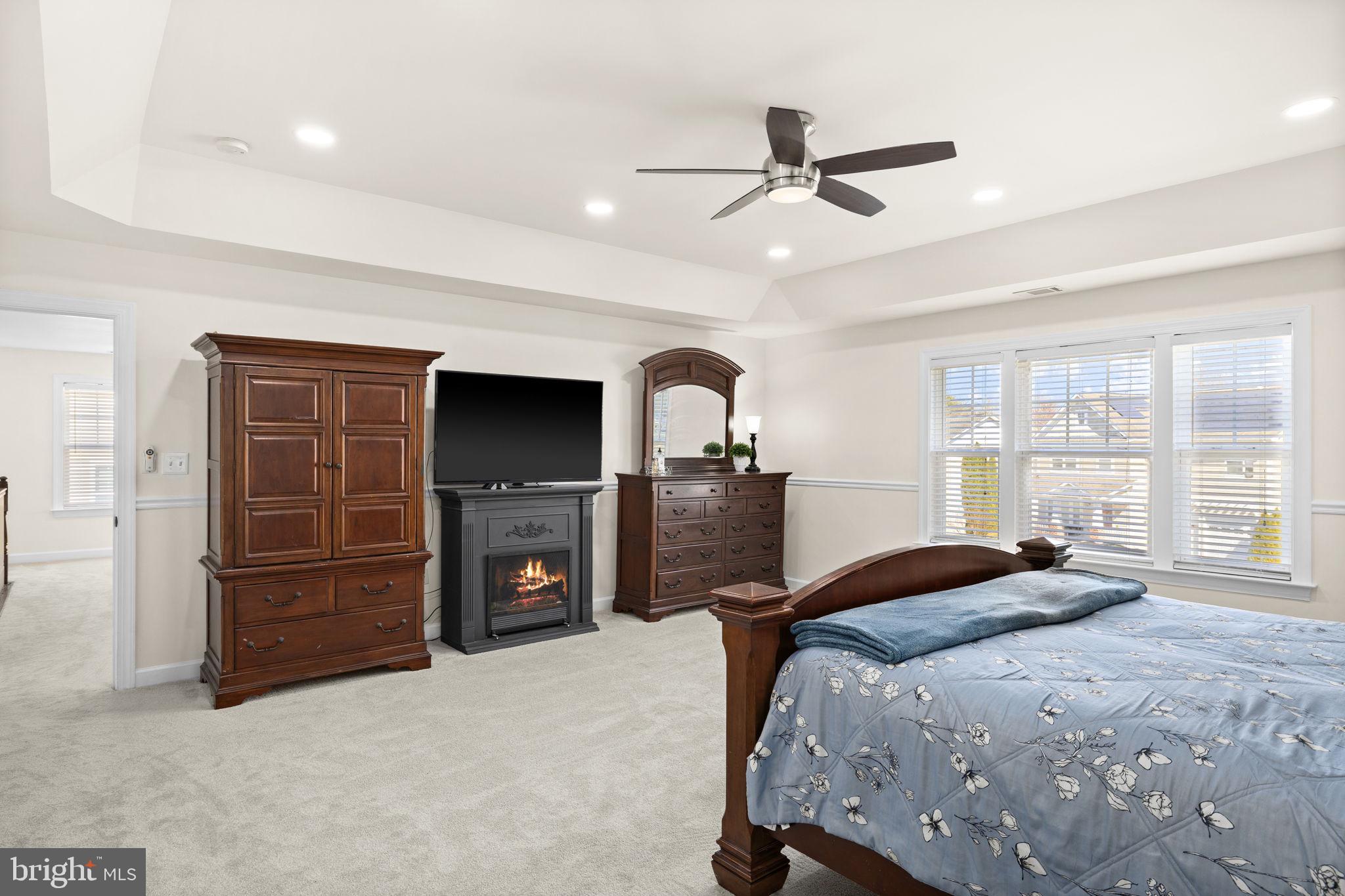4185 Agency Loop Triangle, VA 22172 - Photo 28 of 46 a bedroom with a bed and a television
