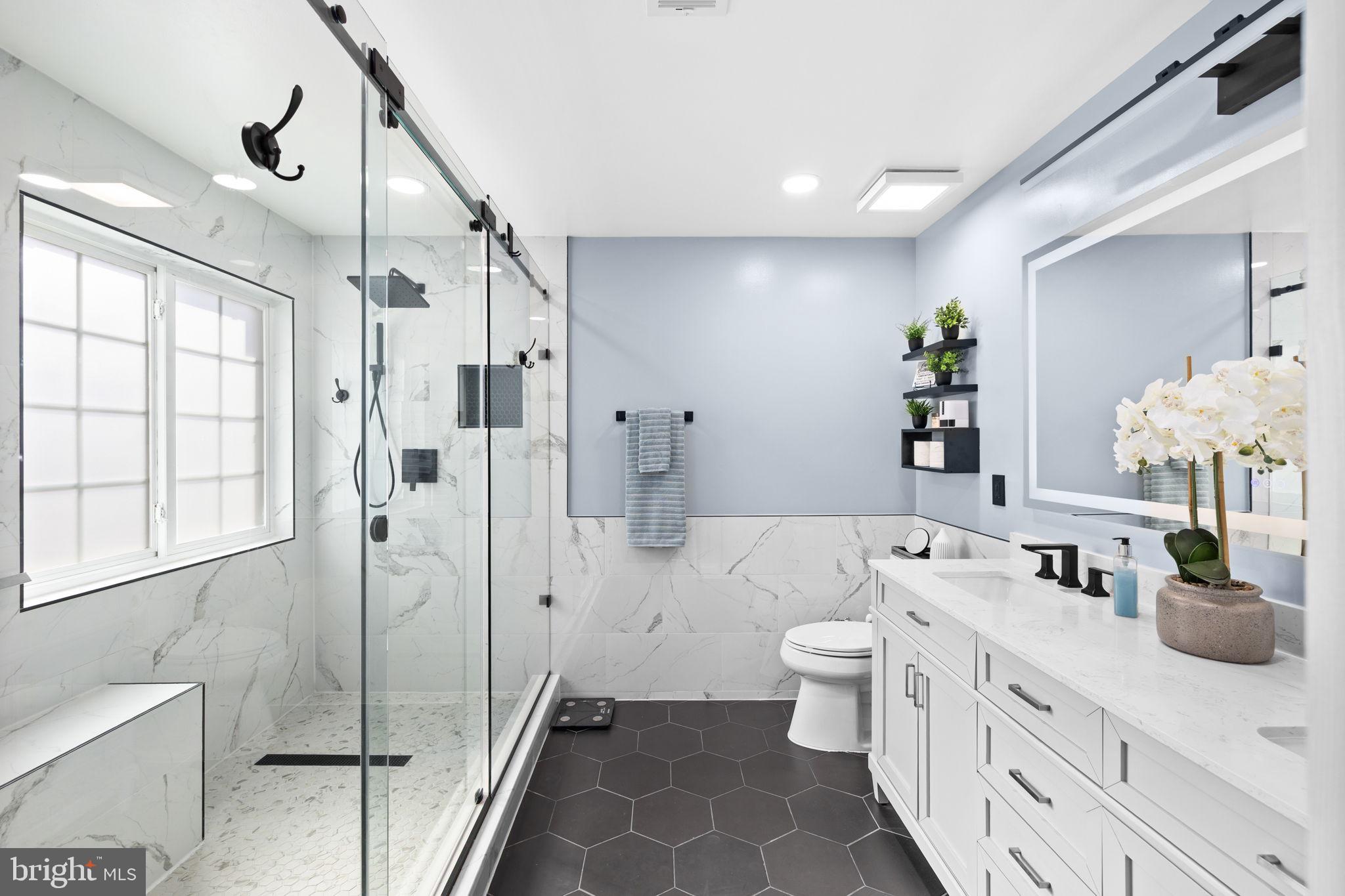 4185 Agency Loop Triangle, VA 22172 - Photo 29 of 46 a bathroom with a double vanity sink mirror and toilet