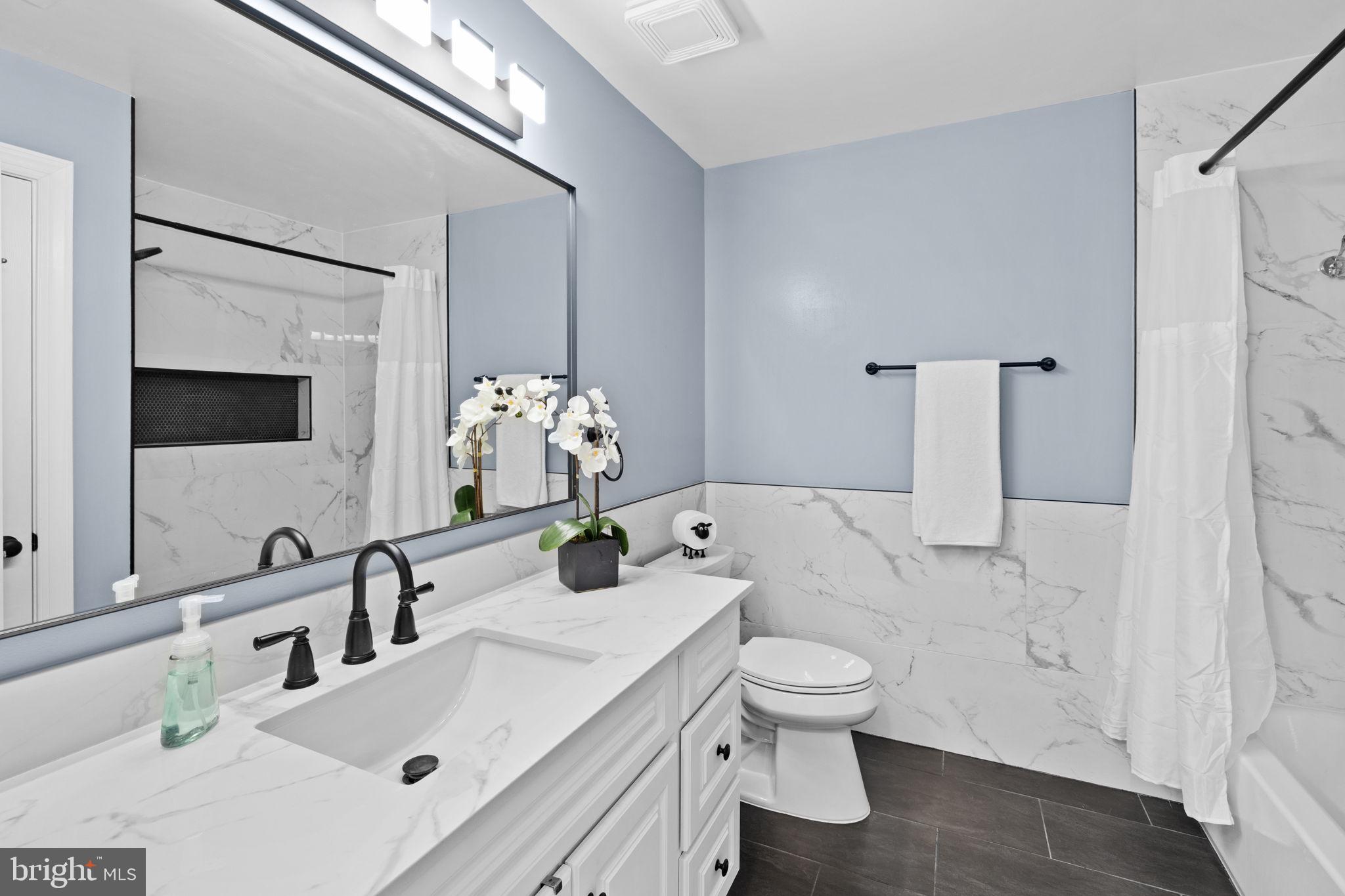 4185 Agency Loop Triangle, VA 22172 - Photo 35 of 46 a bathroom with a sink toilet and shower