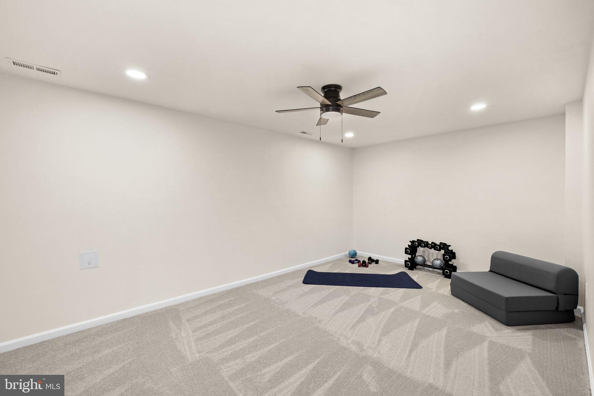 4185 Agency Loop Triangle, VA 22172 - Photo 39 of 46 a view of a big room with a ceiling fan
