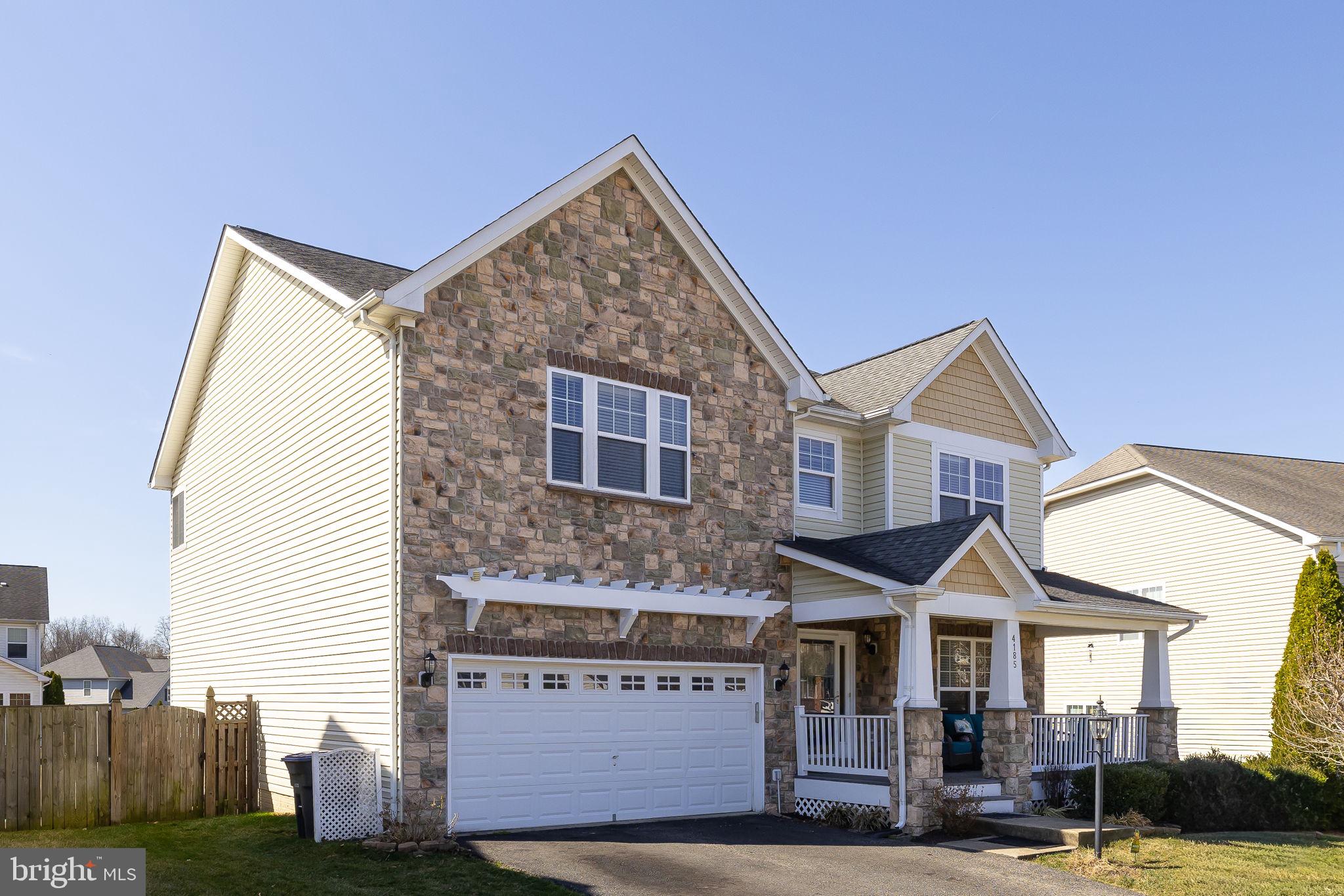 4185 Agency Loop Triangle, VA 22172 - Photo 41 of 46 a view of a house with a yard