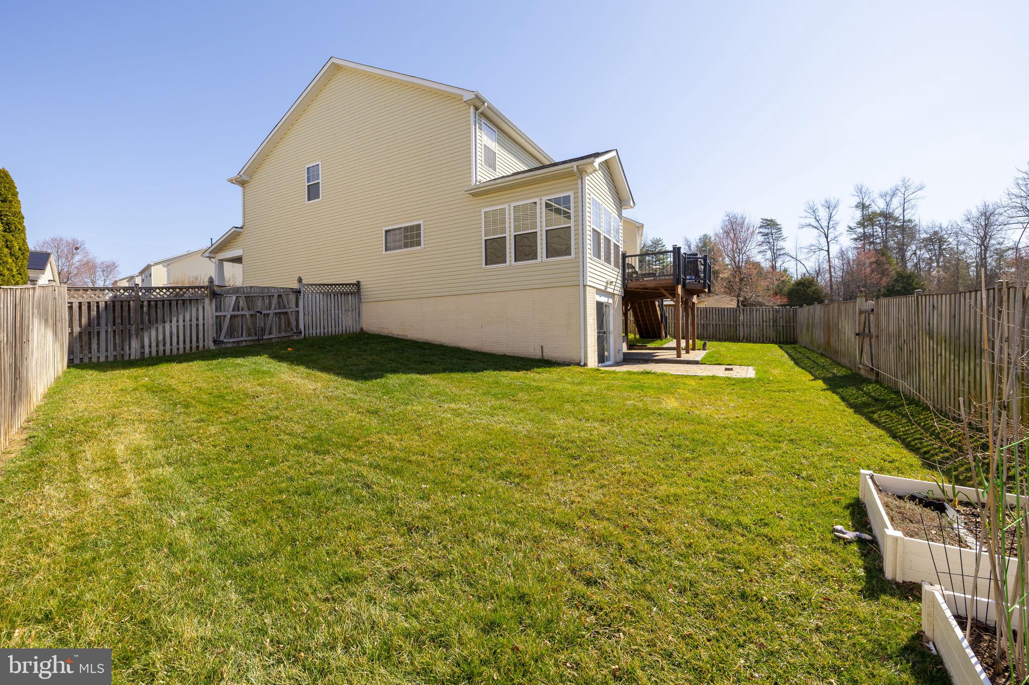 4185 Agency Loop Triangle, VA 22172 - Photo 43 of 46 a view of a swimming pool with an outdoor space and seating area
