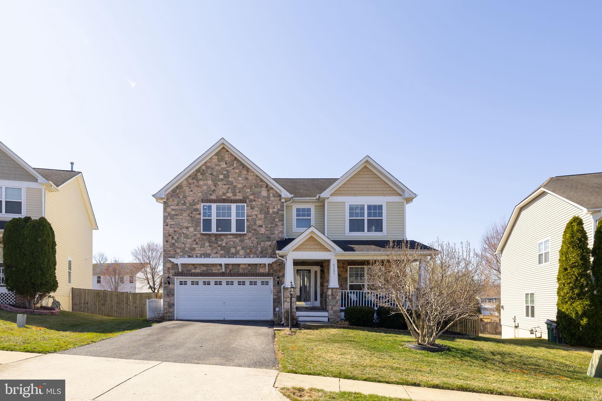 4185 Agency Loop Triangle, VA 22172 - Photo 46 of 46 a front view of a house with a yard