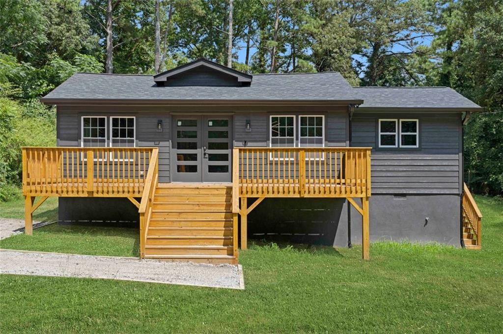 5630 Old Bill Cook Road Atlanta, GA 30349 - Photo 1 of 1 a front view of a house with a yard