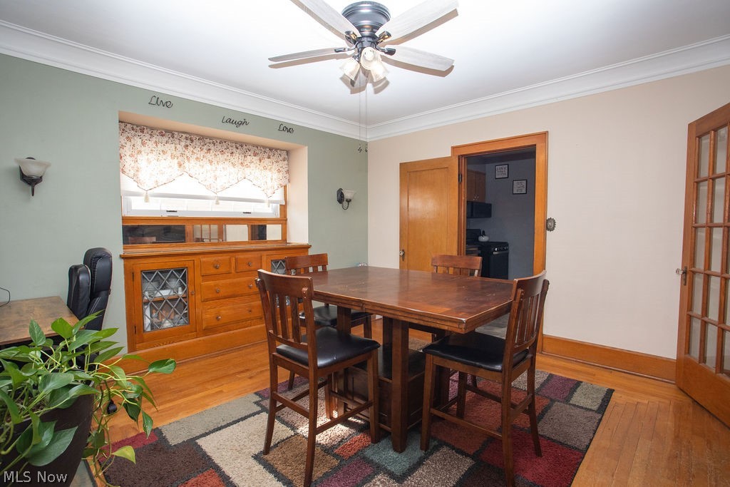 213 Como Street Struthers, OH 44471 - Photo 6 of 25 Dining room with wood floors, high ceilings, French doors, and built in China cabinet