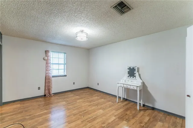 a bathroom with a sink vanity granite and toilet