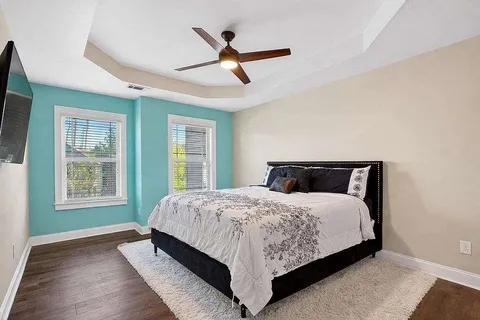 a bedroom with a large bed and a window