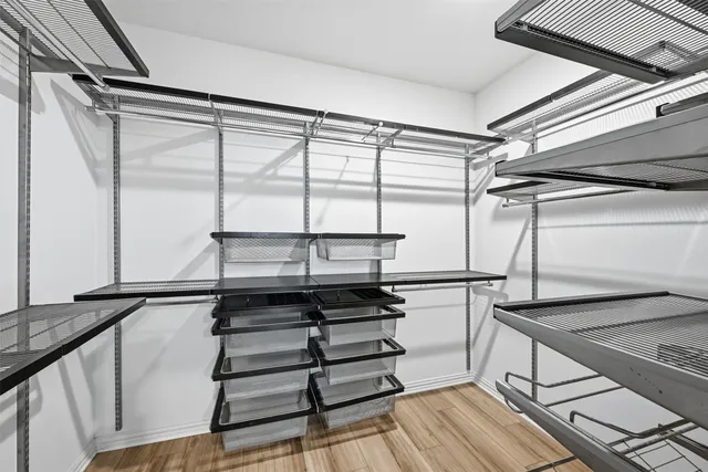 a kitchen with a refrigerator and a window