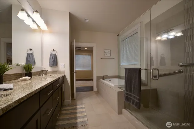 a kitchen with granite countertop a refrigerator and a sink