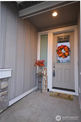 a view of empty room with a fireplace and cabinet