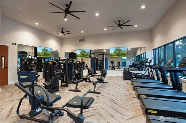 a view of a patio with a table chairs and a fire pit