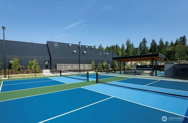 a view of outdoor sitting area with furniture and fire pit