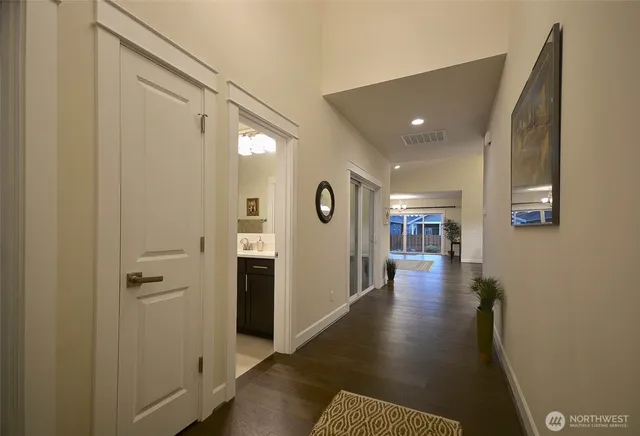 a view of a hallway with seating area