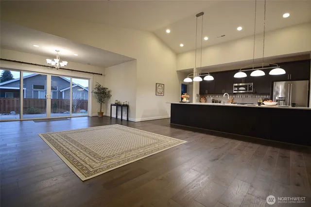 an open kitchen with sink and mirror