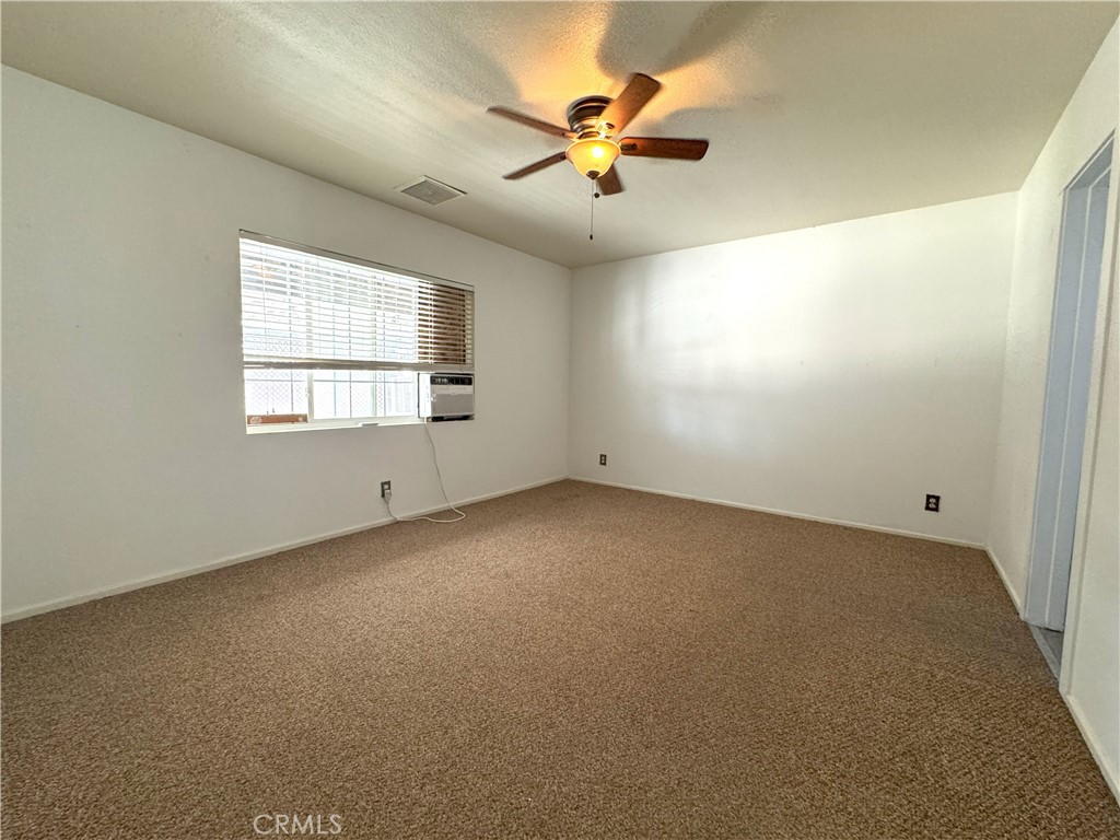 543 Weiman Avenue Ridgecrest, CA 93555 - Photo 19 of 37 a view of an empty room with a window