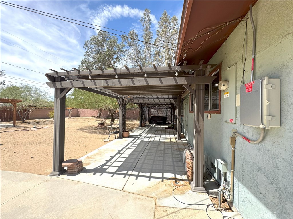 543 Weiman Avenue Ridgecrest, CA 93555 - Photo 23 of 37 a view of a patio with a table and chairs