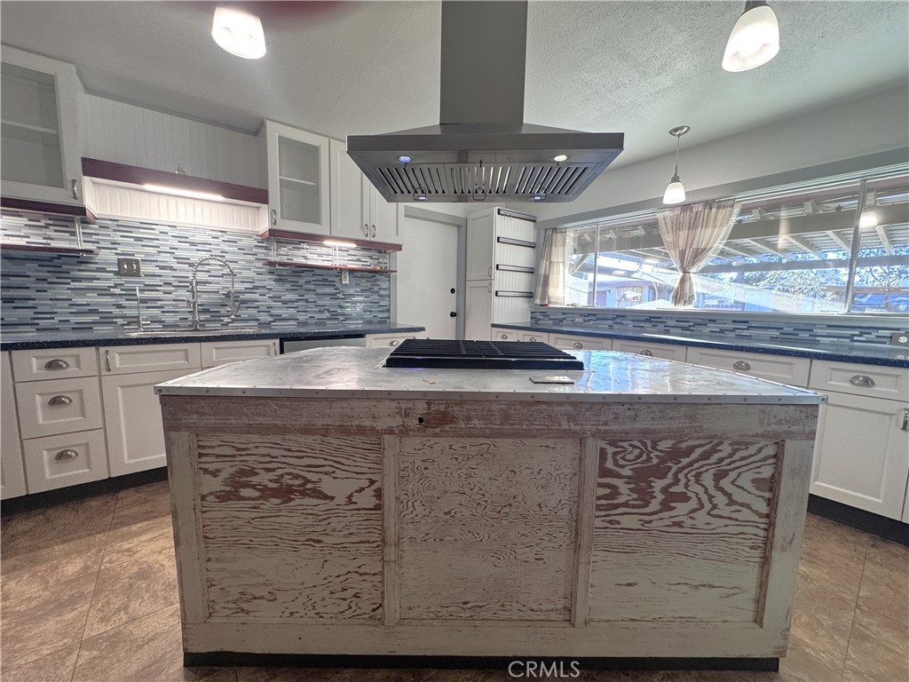 543 Weiman Avenue Ridgecrest, CA 93555 - Photo 32 of 37 a kitchen with a sink a counter space and wooden floor