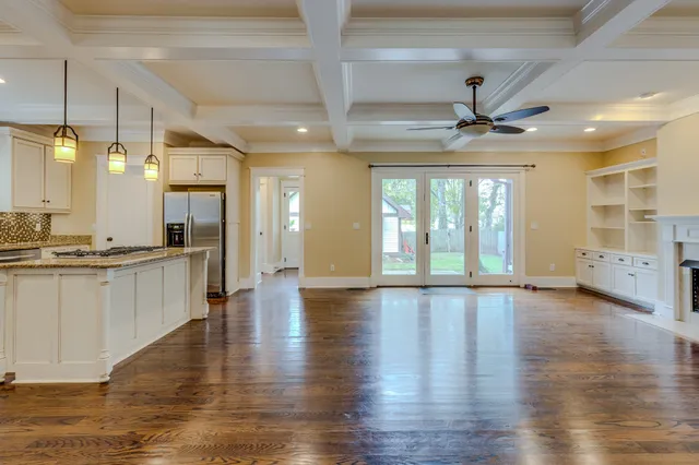 a kitchen with cabinets appliances a sink and a counter top space