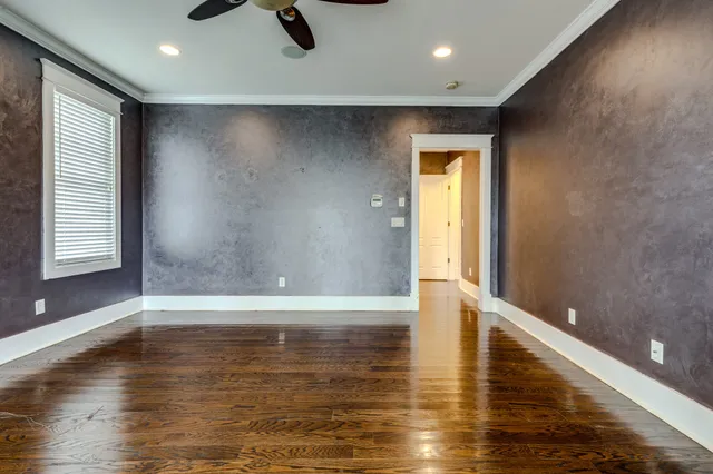 a bathroom with a granite countertop sink a mirror and a bathtub