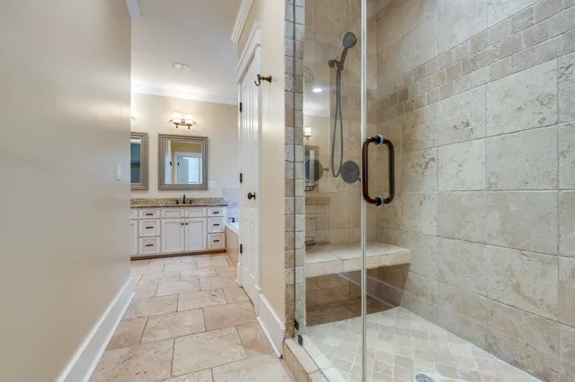 a view of walk in closet with wooden floor