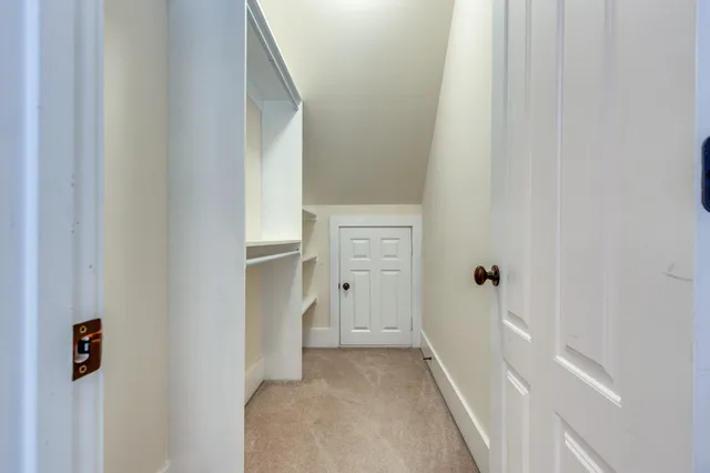 a spacious bathroom with a granite countertop sink and a mirror